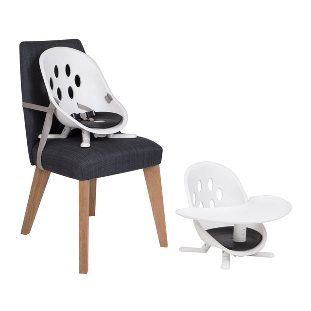 phil&teds poppy modes kit accesorio mostrado en uso en una silla de comedor y como asiento de suelo_assorted