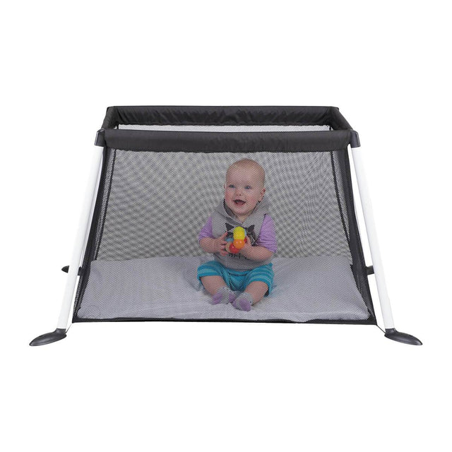 phil&teds traveller travel cot with mesh sides and baby playing inside side view_black