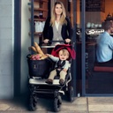 Mum and son walking out of cafe in the duet buggy with joey toe bag full of groceries_default